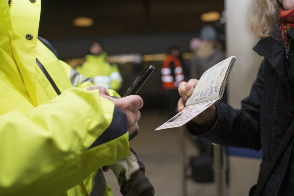 Cropped image of security photographing passport