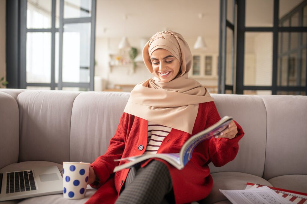 Smart girl feeling relaxed while learning English